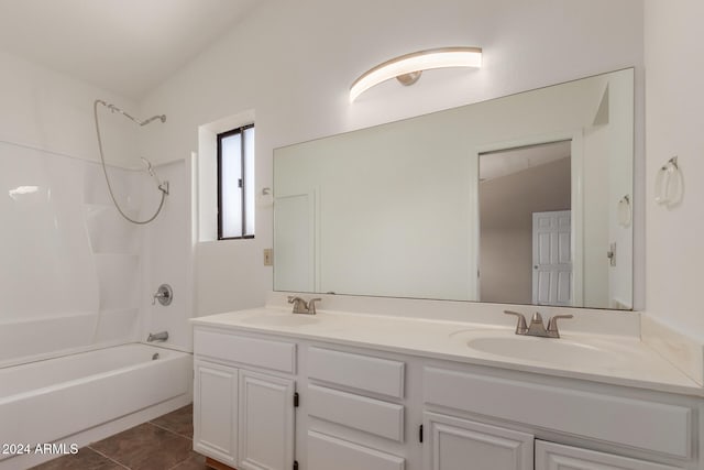 bathroom with vanity, tile patterned floors, lofted ceiling, and tub / shower combination