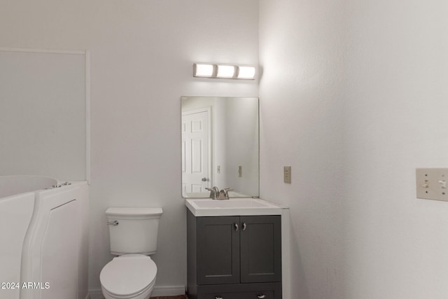 bathroom with toilet and vanity