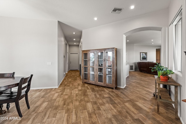 hall with hardwood / wood-style flooring