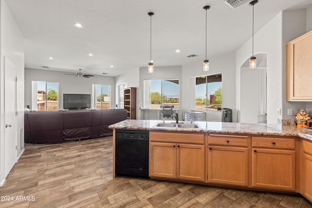 kitchen featuring sink, ceiling fan, light stone countertops, black dishwasher, and decorative light fixtures