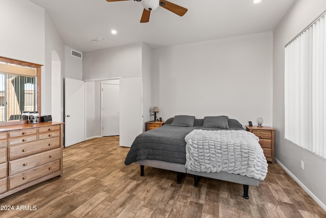 bedroom with ceiling fan and hardwood / wood-style flooring