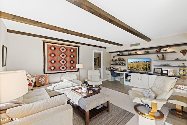 living room with hardwood / wood-style floors and beam ceiling