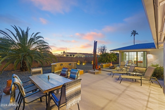 view of patio terrace at dusk