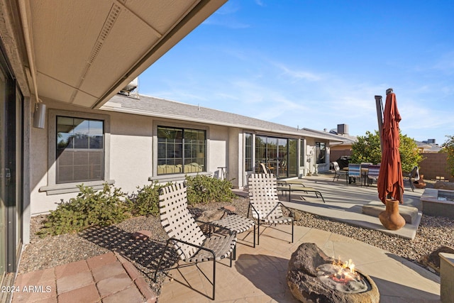 view of patio / terrace with a fire pit