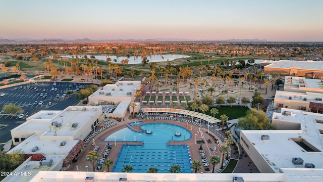 aerial view at dusk with a water view