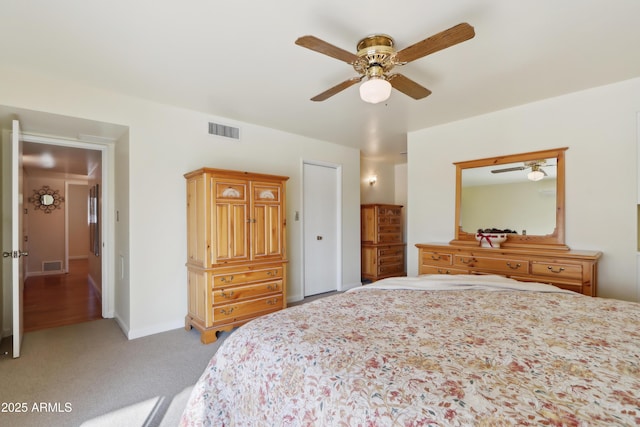 bedroom with light carpet and ceiling fan