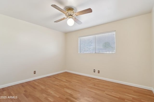 empty room with light hardwood / wood-style flooring and ceiling fan