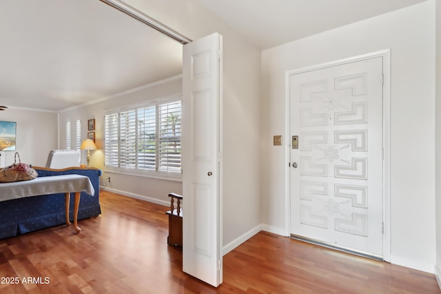 bedroom with wood-type flooring and ornamental molding