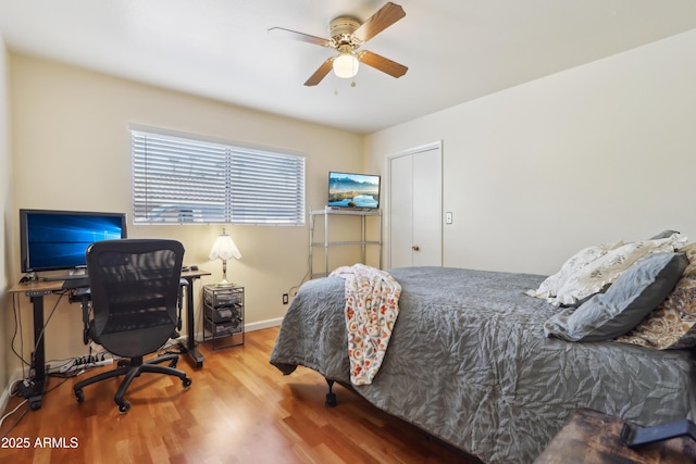 bedroom featuring ceiling fan and hardwood / wood-style floors