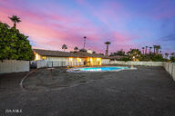 view of pool at dusk