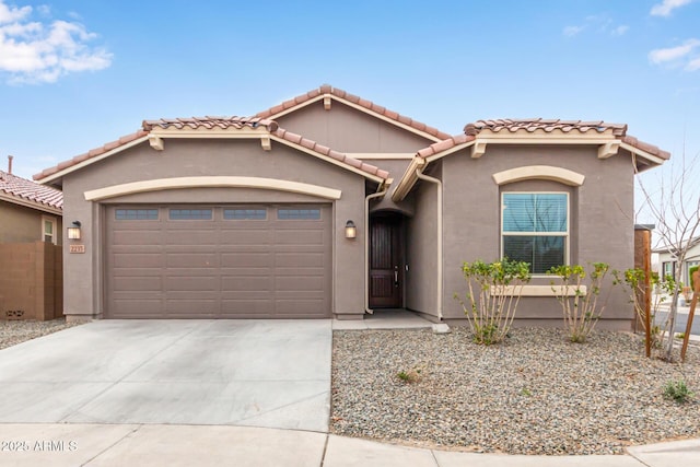 mediterranean / spanish-style home featuring a garage