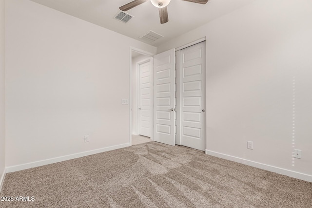 unfurnished bedroom featuring a closet, carpet flooring, and ceiling fan