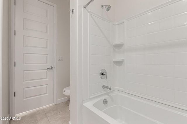 bathroom featuring toilet, tile patterned flooring, and tub / shower combination