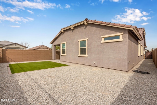 rear view of house with a patio