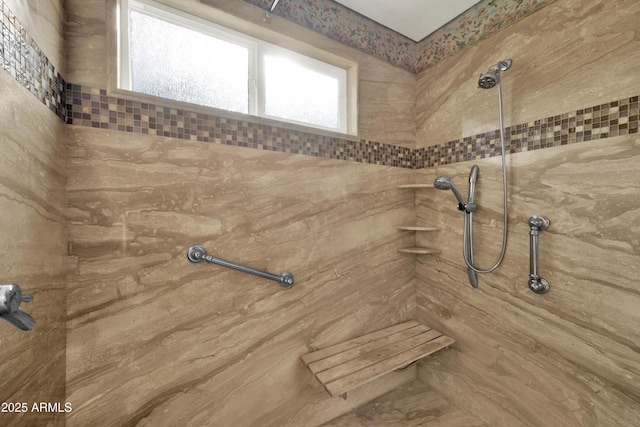 bathroom with tiled shower