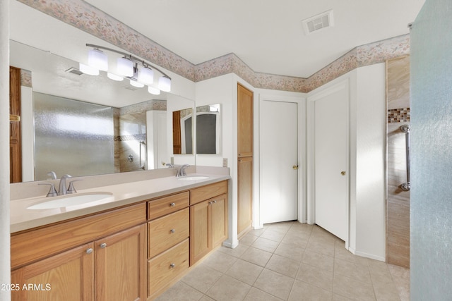 bathroom featuring vanity and tile patterned flooring