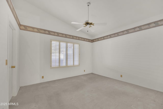 unfurnished room featuring vaulted ceiling, light colored carpet, and ceiling fan