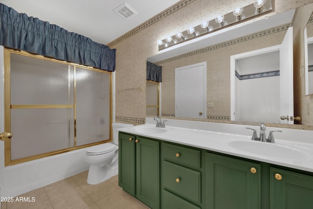 full bathroom with vanity, tile patterned floors, shower / bath combination with glass door, and toilet