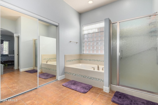 bathroom featuring tile patterned floors and plus walk in shower