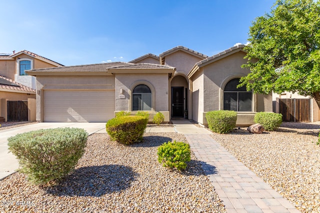 mediterranean / spanish-style home featuring a garage