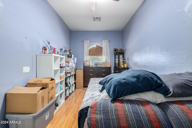 bedroom featuring hardwood / wood-style floors and ceiling fan