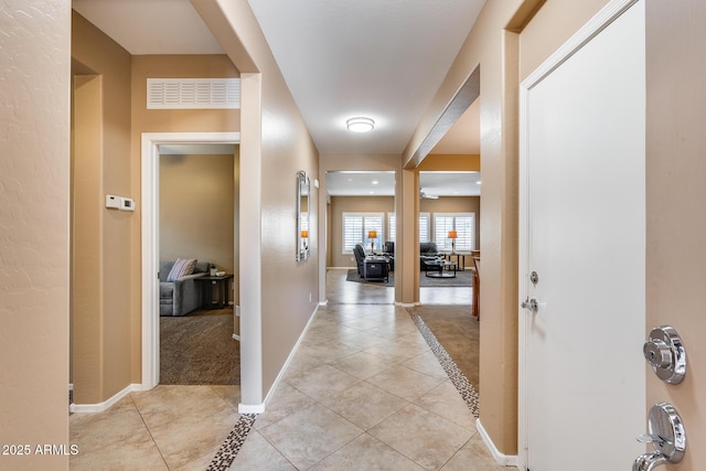 9952 W Jessie Ln, Peoria, AZ 85383 - corridor with light tile patterned floors and baseboards