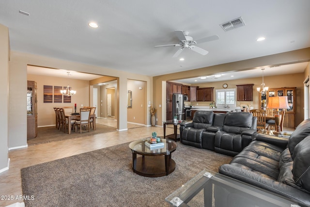 9952 W Jessie Ln, Peoria, AZ 85383 - living area featuring a chandelier, baseboards, a ceiling fan, light tile patterned flooring, and recessed lighting
