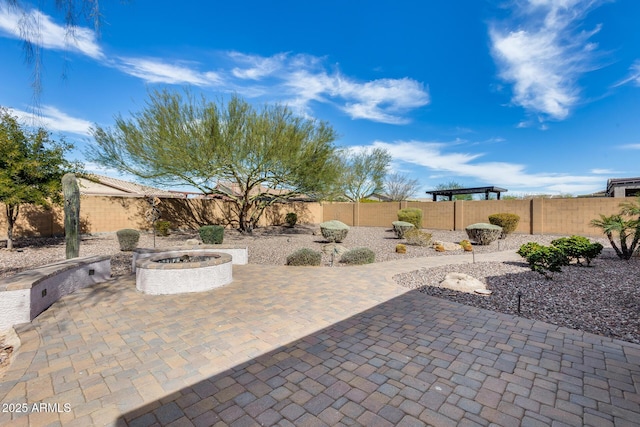 9952 W Jessie Ln, Peoria, AZ 85383 - fenced backyard featuring an outdoor fire pit and a patio