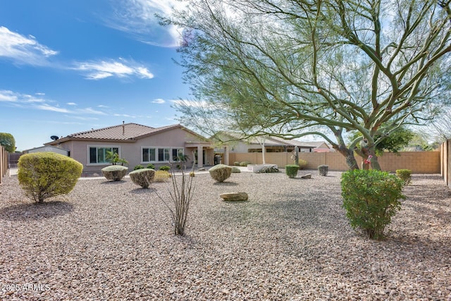 9952 W Jessie Ln, Peoria, AZ 85383 - back of house with stucco siding, a fenced backyard, and a tile roof