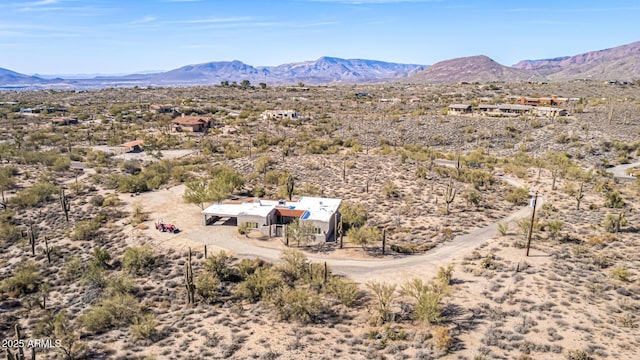 aerial view featuring view of desert and a mountain view