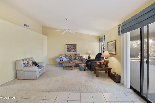 sitting room featuring ceiling fan, light colored carpet, and vaulted ceiling