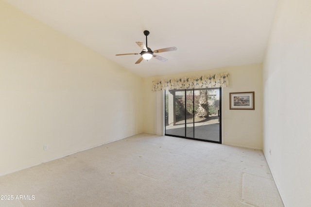 unfurnished room with ceiling fan, light colored carpet, and lofted ceiling