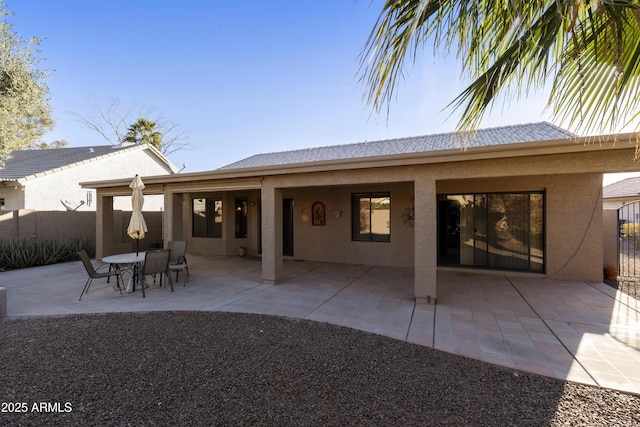 rear view of house featuring a patio