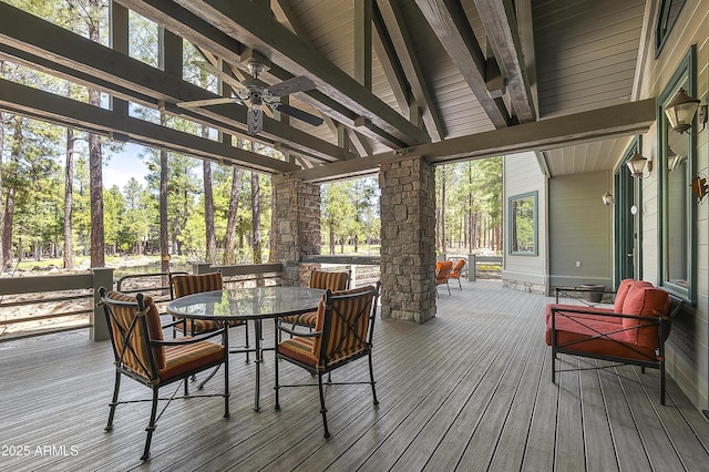2036 Bessie Kidd Best, Flagstaff, AZ 86005 - wooden deck with outdoor dining space and ceiling fan