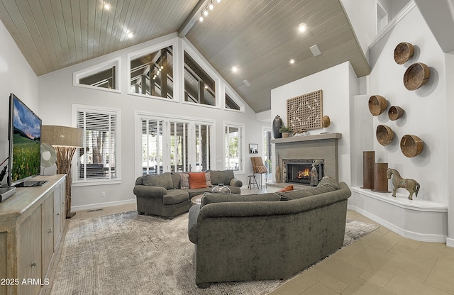 2036 Bessie Kidd Best, Flagstaff, AZ 86005 - living room featuring baseboards, a lit fireplace, high vaulted ceiling, wooden ceiling, and recessed lighting