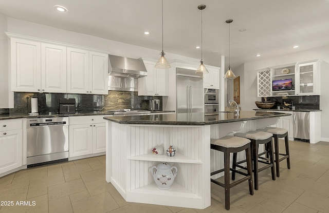 2036 Bessie Kidd Best, Flagstaff, AZ 86005 - kitchen featuring open shelves, stainless steel appliances, wall chimney range hood, tasteful backsplash, and recessed lighting