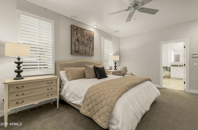 2036 Bessie Kidd Best, Flagstaff, AZ 86005 - carpeted bedroom with baseboards, ensuite bathroom, and ceiling fan