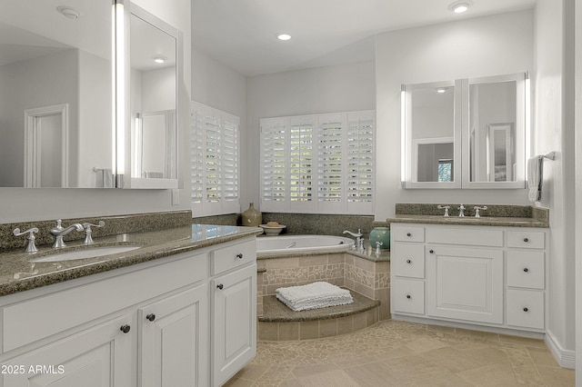 2036 Bessie Kidd Best, Flagstaff, AZ 86005 - full bathroom featuring a garden tub, tile patterned flooring, and two vanities