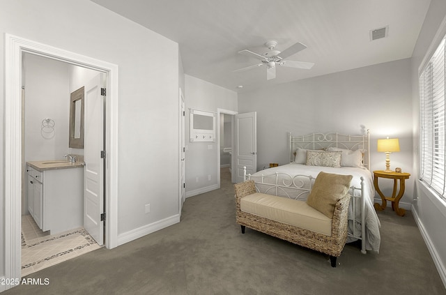 2036 Bessie Kidd Best, Flagstaff, AZ 86005 - bedroom with light carpet, baseboards, a sink, and multiple windows