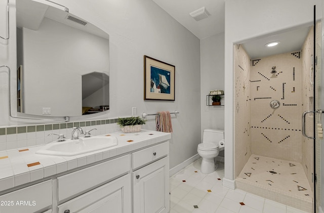 2036 Bessie Kidd Best, Flagstaff, AZ 86005 - full bath with a shower stall, toilet, tile patterned flooring, vanity, and baseboards