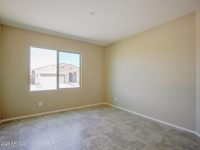 spare room featuring light tile flooring