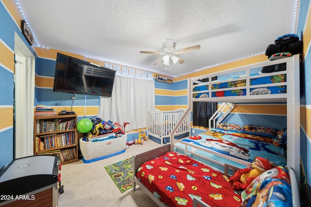 carpeted bedroom featuring a textured ceiling