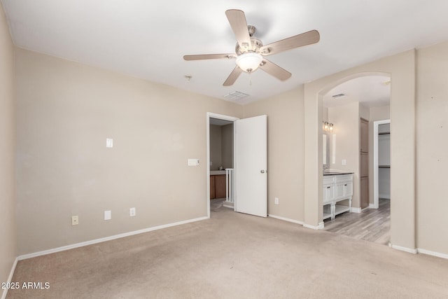1968 E Emily Ln, Gilbert, AZ 85295 - unfurnished bedroom featuring visible vents, baseboards, arched walkways, carpet, and ensuite bath