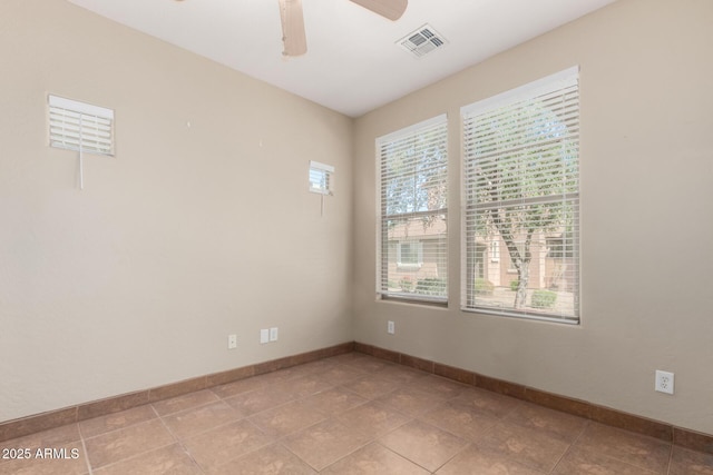 1968 E Emily Ln, Gilbert, AZ 85295 - spare room with light tile patterned floors, baseboards, a ceiling fan, and visible vents