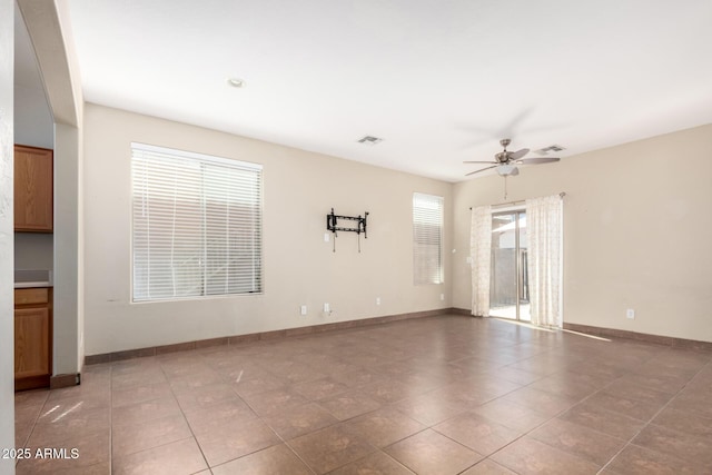 1968 E Emily Ln, Gilbert, AZ 85295 - unfurnished room with visible vents, baseboards, ceiling fan, and light tile patterned flooring