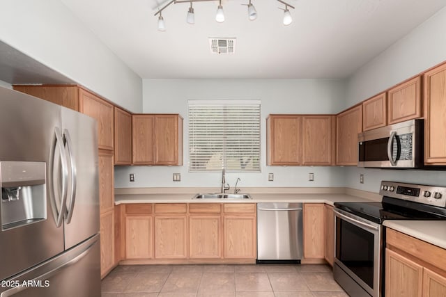 1968 E Emily Ln, Gilbert, AZ 85295 - kitchen with visible vents, light countertops, a sink, light tile patterned floors, and stainless steel appliances