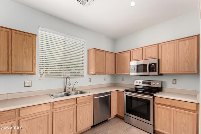 1968 E Emily Ln, Gilbert, AZ 85295 - kitchen with stainless steel appliances, visible vents, a sink, and light brown cabinets