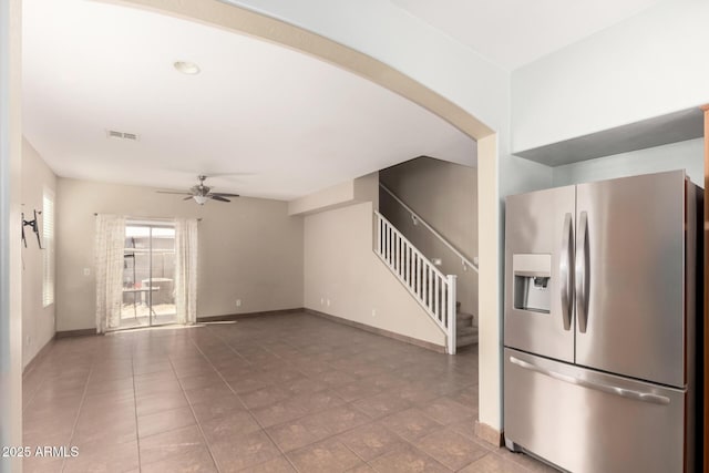 1968 E Emily Ln, Gilbert, AZ 85295 - unfurnished living room featuring stairs, a ceiling fan, baseboards, and visible vents