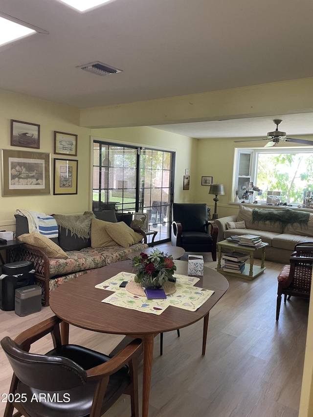 4814 N 35th St, Phoenix, AZ 85018 - living area featuring plenty of natural light, light wood-style flooring, and a ceiling fan
