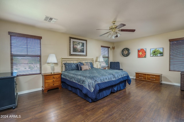 bedroom with ceiling fan and dark hardwood / wood-style floors